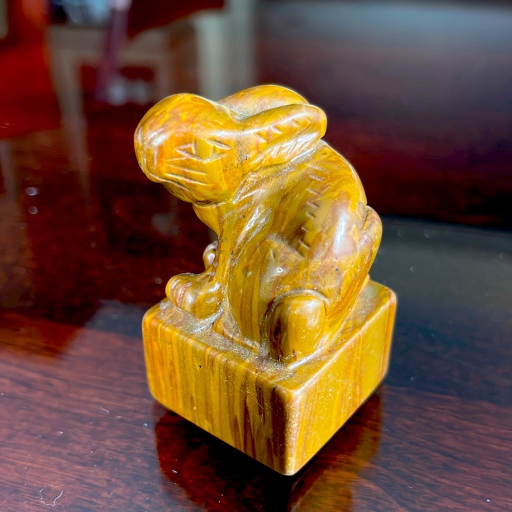 Stone carved bunny. The grain of the rock make me think petrified wood